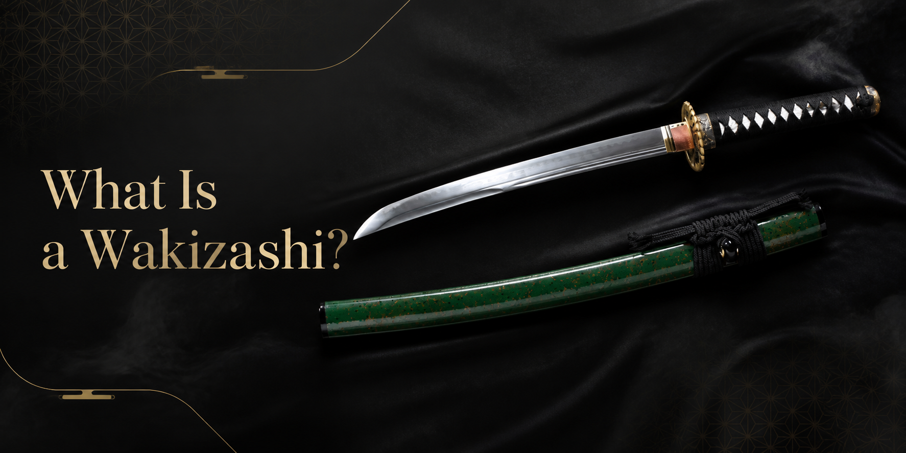 Wakizashi with a polished curved blade, black-wrapped handle, gold-toned tsuba, and green saya displayed on black fabric beside the title “What Is a Wakizashi?”