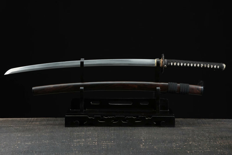 What is a Katana ? Katana is a Japanese sword characterized by a curved, single-edged blade with a circular or squared guard and a long grip to accommodate two hands | KatanaSwordArt